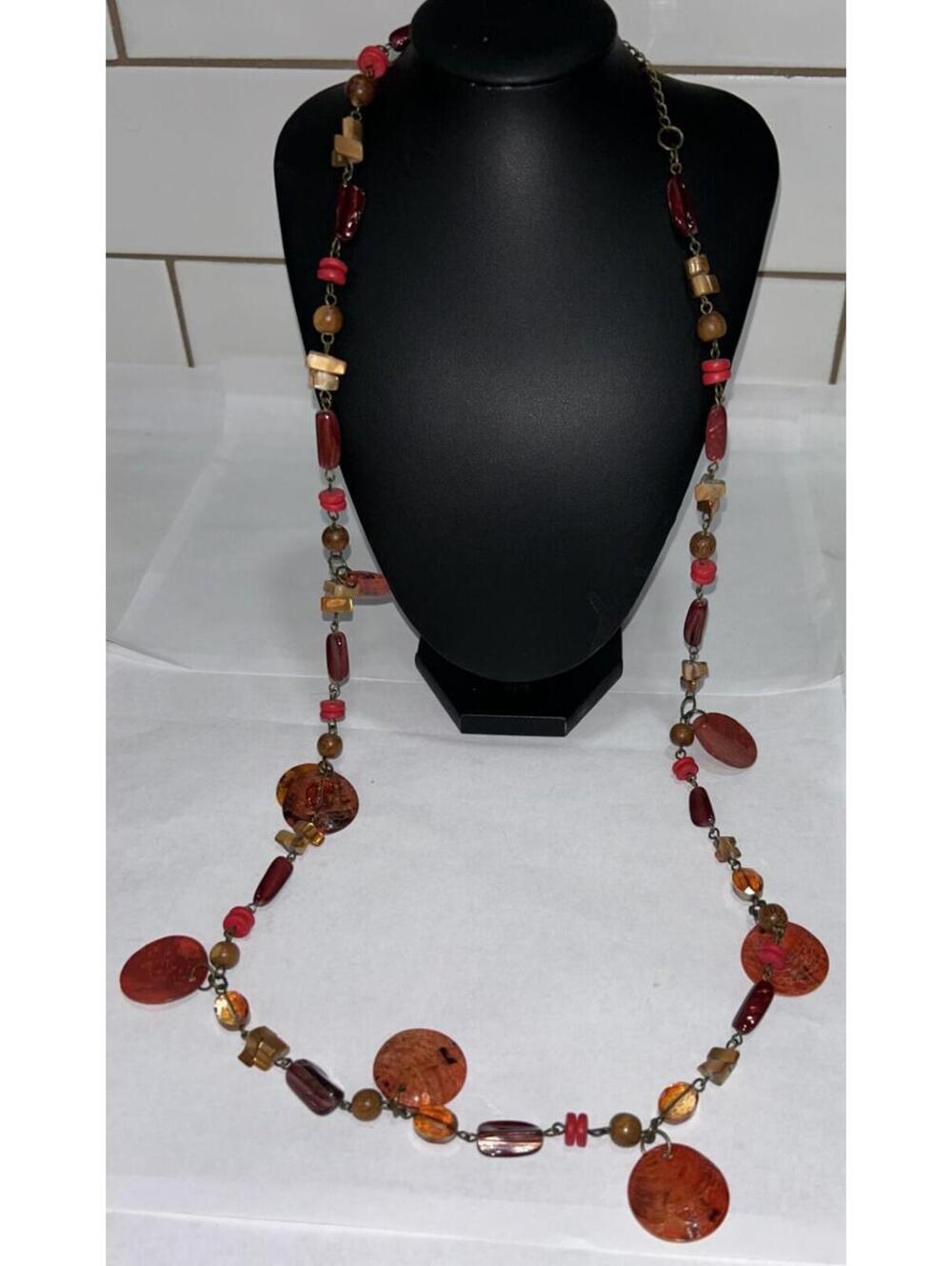 Vintage Shell necklace with glass beads and stone accents - orange hues